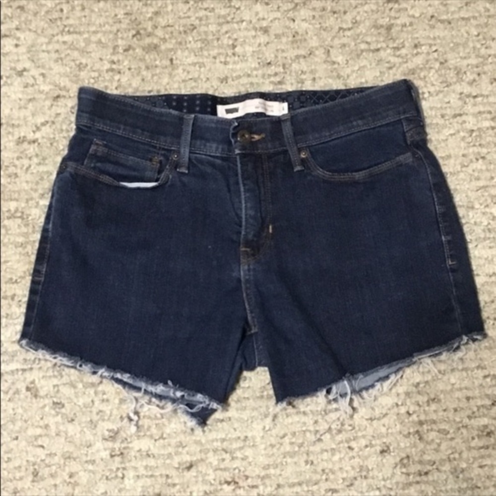 Levi’s 525 Cutoff Fringe Medium To Dark Wash Blue Jean Shorts size 4